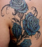Beautiful Swirly Blue Roses Back Tattoo for Women