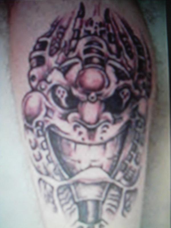 Tribal Abstract Smiling Face Monster Tattoo