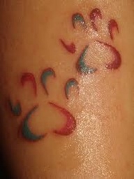 Cool Coloured Paw Prints Tattoo On Body