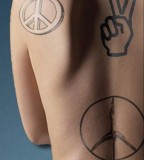 Daisy Peace Tattoo On Back Pictures And Images NSFW