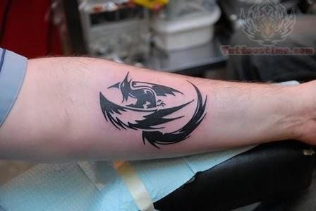 Tribal Phoenix Tattoo On Arm For Men