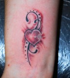 Tribal Bow And Heart Tattoos Images