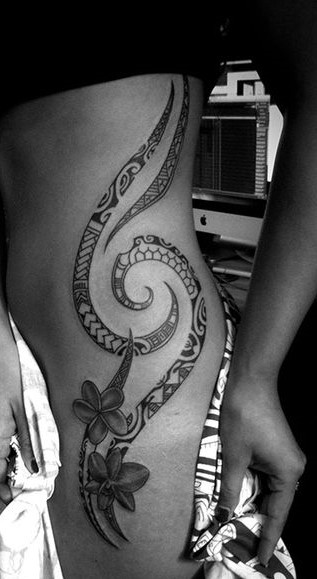 polynesian ribcage and thigh tribal tattoo