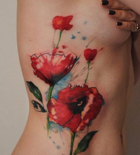 poppy watercolor tattoo on ribcage
