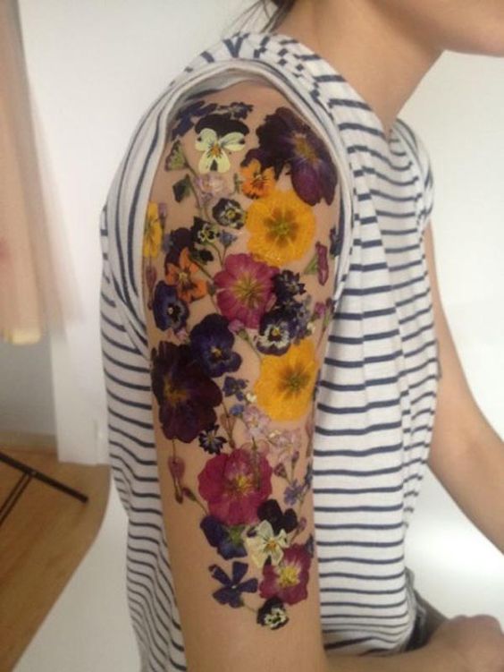 pressed flower effect arm flower tattoo