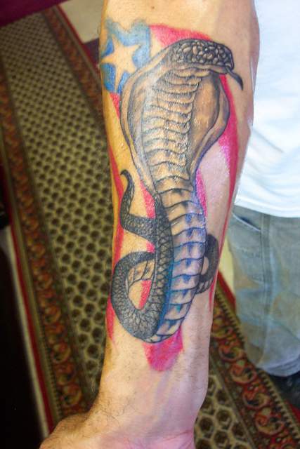 Stunning Puerto Rican Flag King Cobra Tattoo on Men Lower Arm