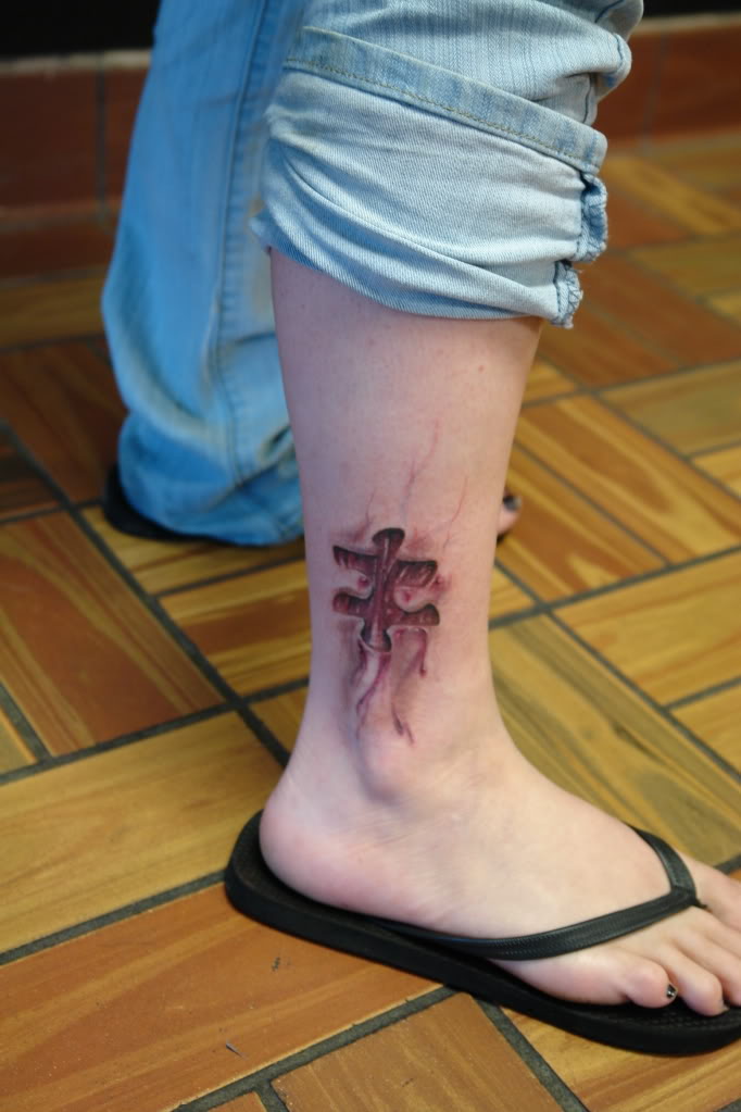 Amazing 3D Bloody Puzzle Piece Leg Tattoo Design