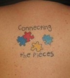 Funny Puzzle Pieces Back Tattoo