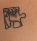 Unsolved Tiny Puzzle Piece Tattoo
