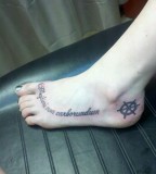 A Latin Quote Tattoo On The Foot In A Nice Cursive Font