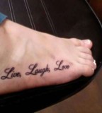 Photo Of Artistic Live Laugh Love Tattoo On Foot