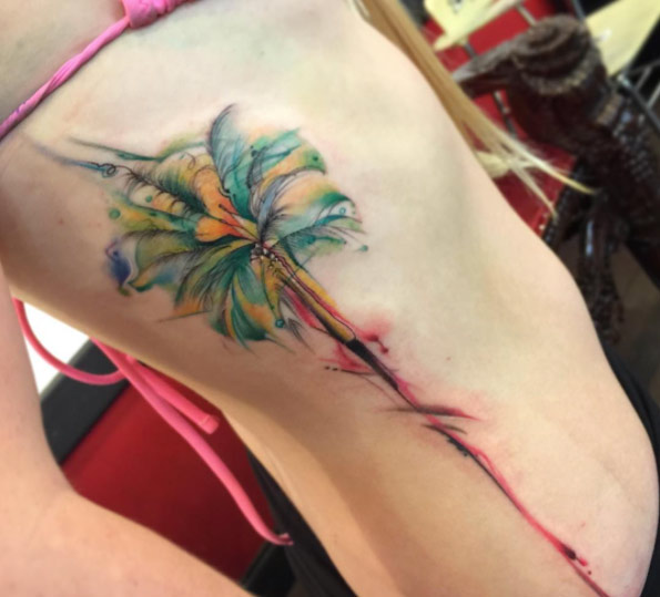 ribcage watercolor flower tattoo