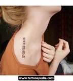 Roman Numeral Tattoo Design On Women Shoulder
