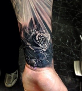 rose flower tattoo on wrist