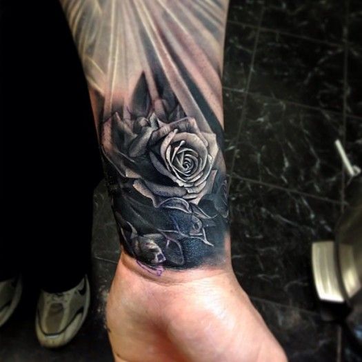 rose flower tattoo on wrist