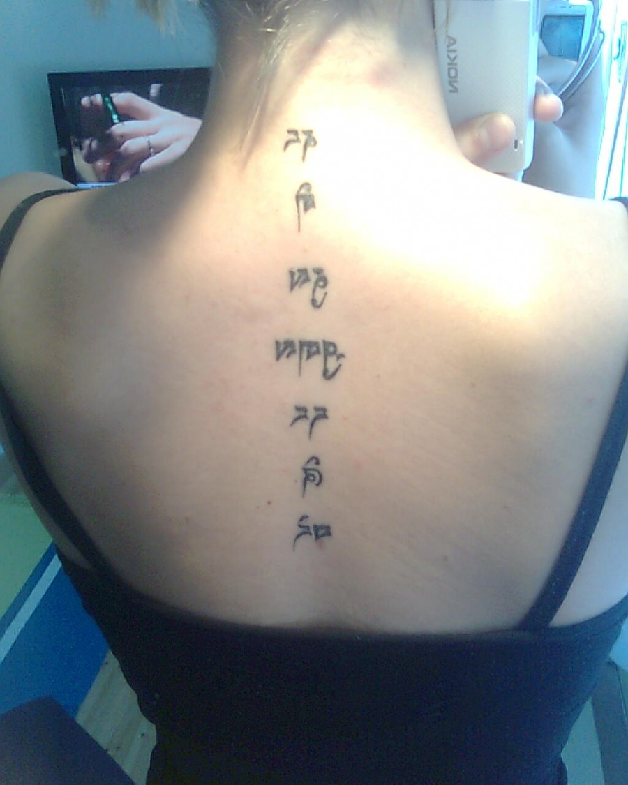 Tibetan Scripture Tattoo on Backbone for Girls