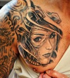 Shoulder Blade Face Tattoo Design