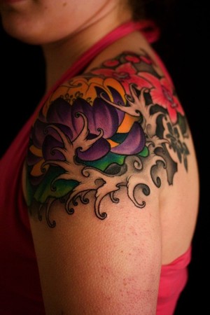 Red and Back Floral Shoulder Tattoo - | TattooMagz › Tattoo Designs