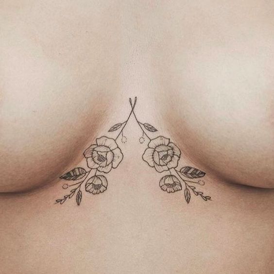 simple underbood flower tattoo