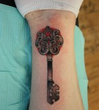 Black Line Studio Skeleton Key Shaped Forearm Tattoo Design
