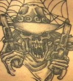 Cowboy Skull With Guns Tattoo
