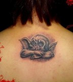 Upper Back Skull Tattoos For Girls