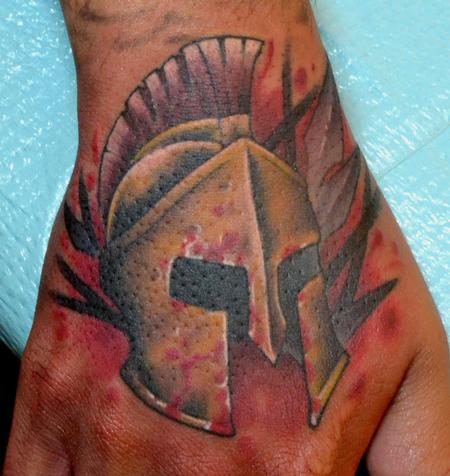 On Hand Spartan Helmet Tattoos