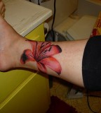 Stunning Lily Flower Tattoo Designs on Foot for Girls