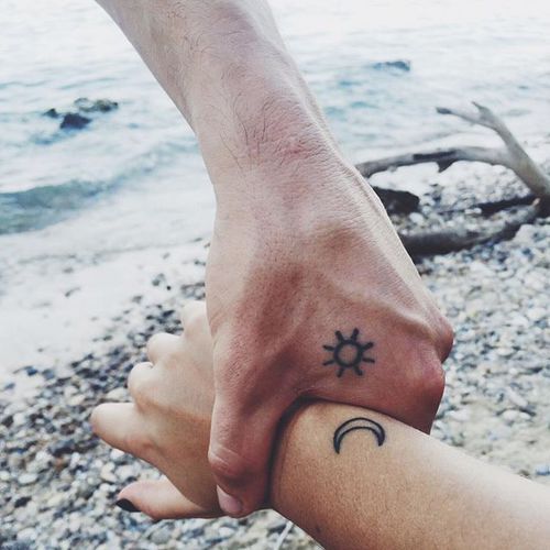 sun and moon on hand couple cattoo
