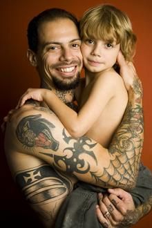 Man with Amazing Tribal Tattoos Design
