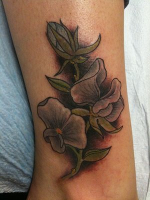 Beautiful Sweet Pea Flowers Tattoo in Dark Shades