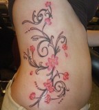 Lovely Rib Cage Swirly Flower Tattoo For Girls