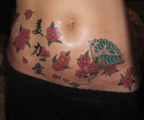 Japanese Swirly Cherry Blossom Tattoo Design on Belly