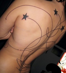 Georgeous Swirling Stars Tattoo on Women Back (NSFW)