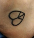 Peace And Love Symbol Tattoo On Foot