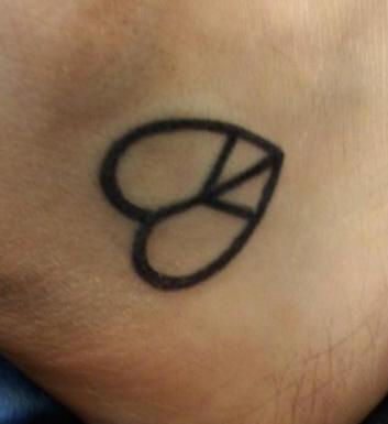 Peace And Love Symbol Tattoo On Foot