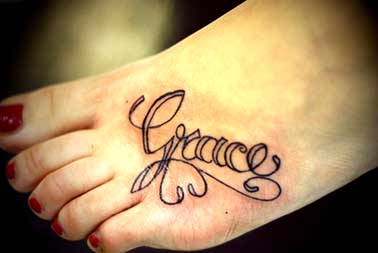Grace’s Name in Swirly Tattoo Design on Leg