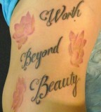 Lettering and Flower Tattoo on Side for Women