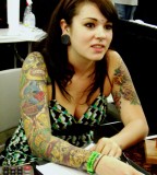 Girl with Painful Tattoo on Arm at Tattoo Expo San Francisco