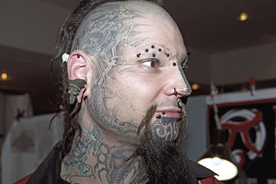 Man with Awesome Full Face Tattoo Design