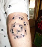 Spinning Musical Note Tattoos