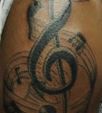 Musical Tattoo With Music Notes And Musical Stuff