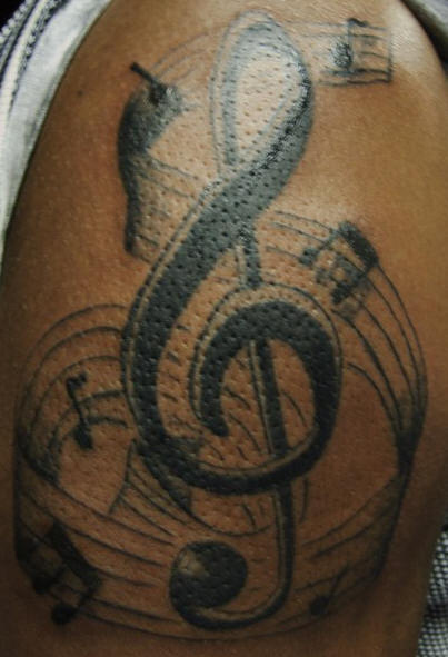 Musical Tattoo With Music Notes And Musical Stuff
