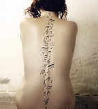 Backbone With Musical Notes Tattoo
