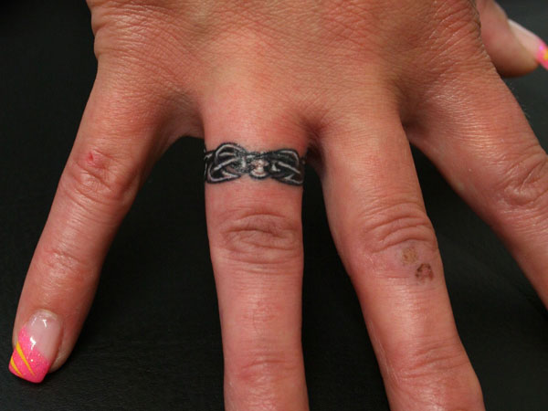Marvelous Tattoo Design on Ring Finger