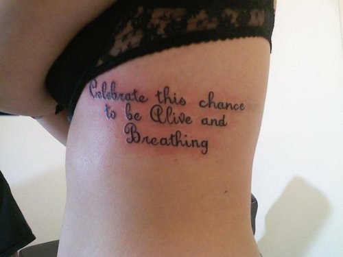 Simple Powerful Tattoo Quotes on Girl’s Ribs (NSFW)