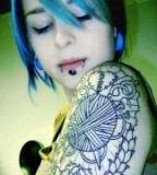 Girl With Arm Tattoo and Piercing