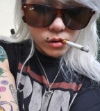 Cigarette Girl with Tattoo and Piercings
