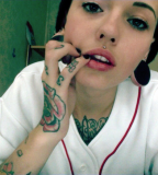 Cute Girl with Hand and Body Tattooed also Pierced