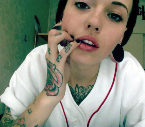Cute Girl with Hand and Body Tattooed also Pierced